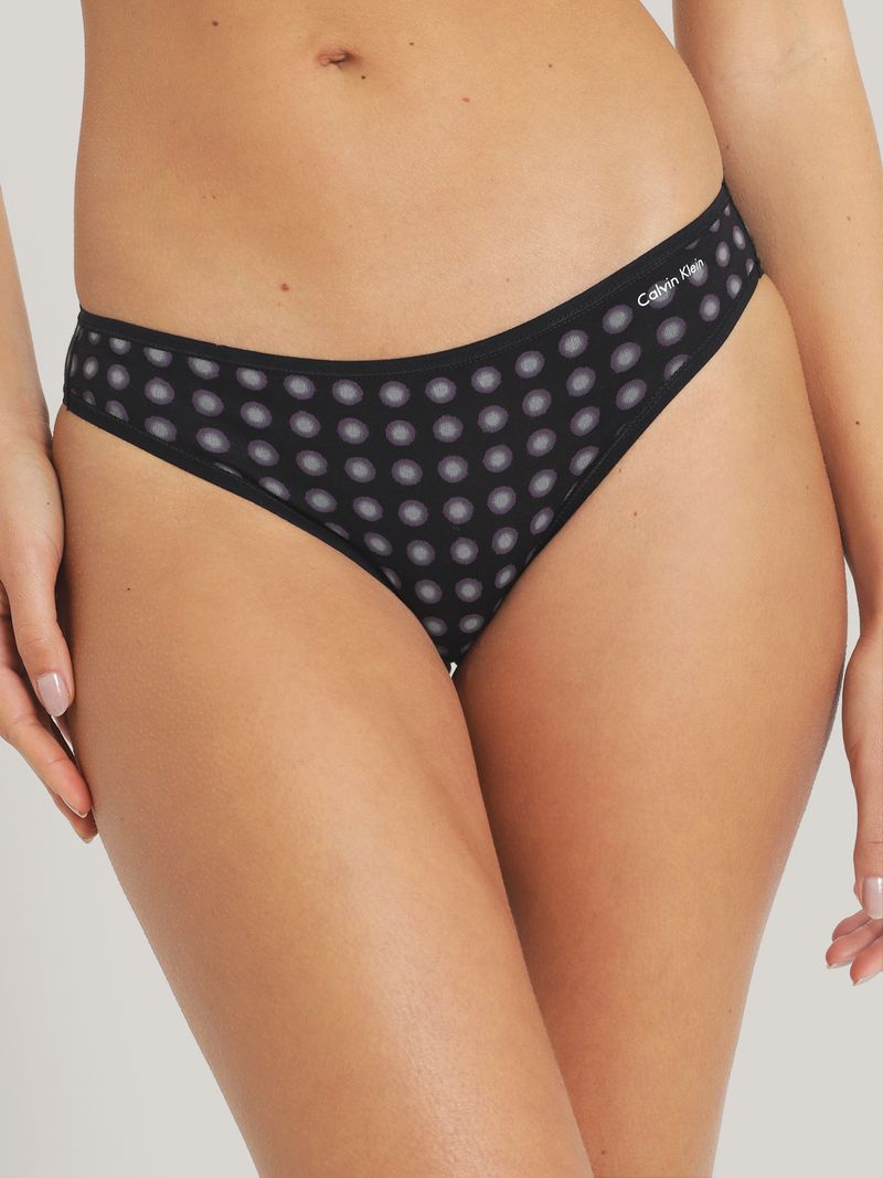 Calzon-negro-con-diseño-de-lunares-transparentes-y-logo-de-Calvin-Klein-en-la-cintura.